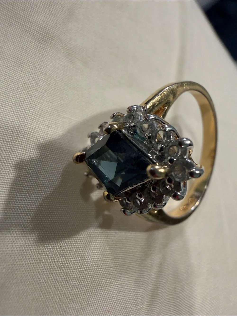 18K Gold Electroplated Ring with Deep Blue Kite-Cut Center and Clear Stones.